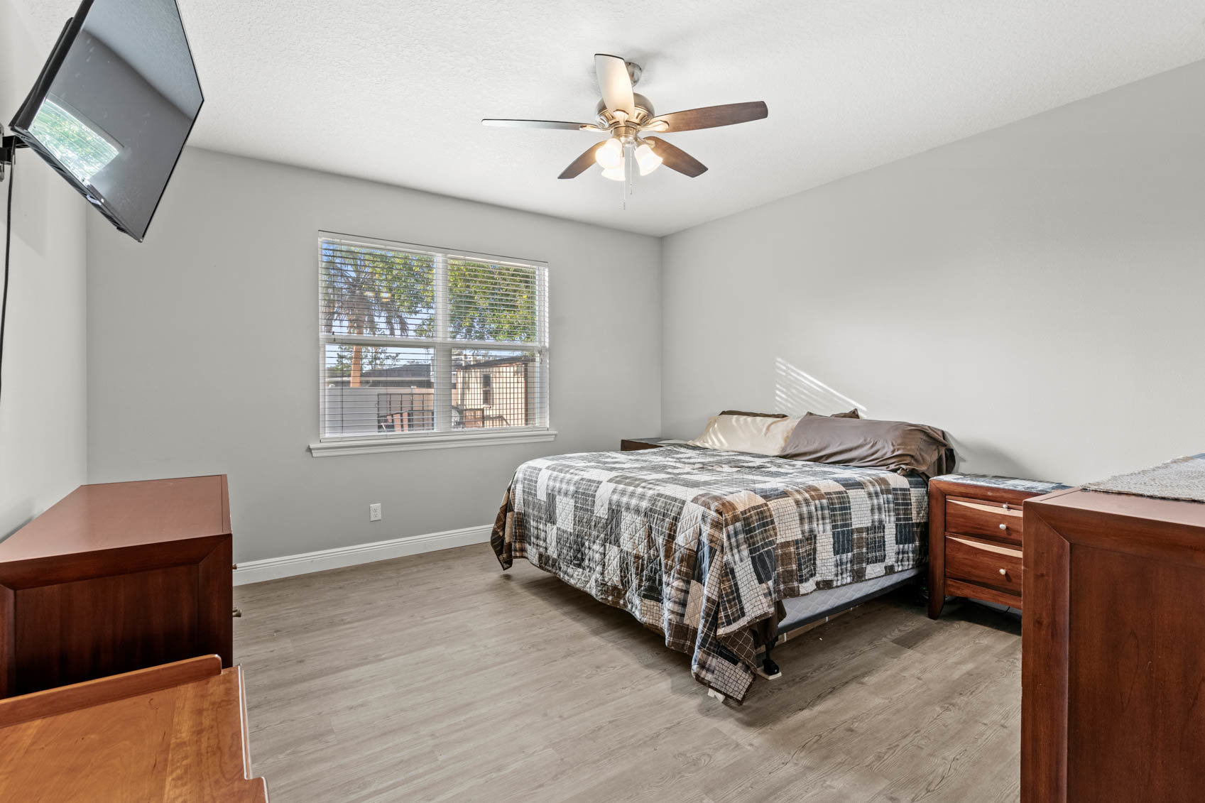 primary bedroom with brown furniture